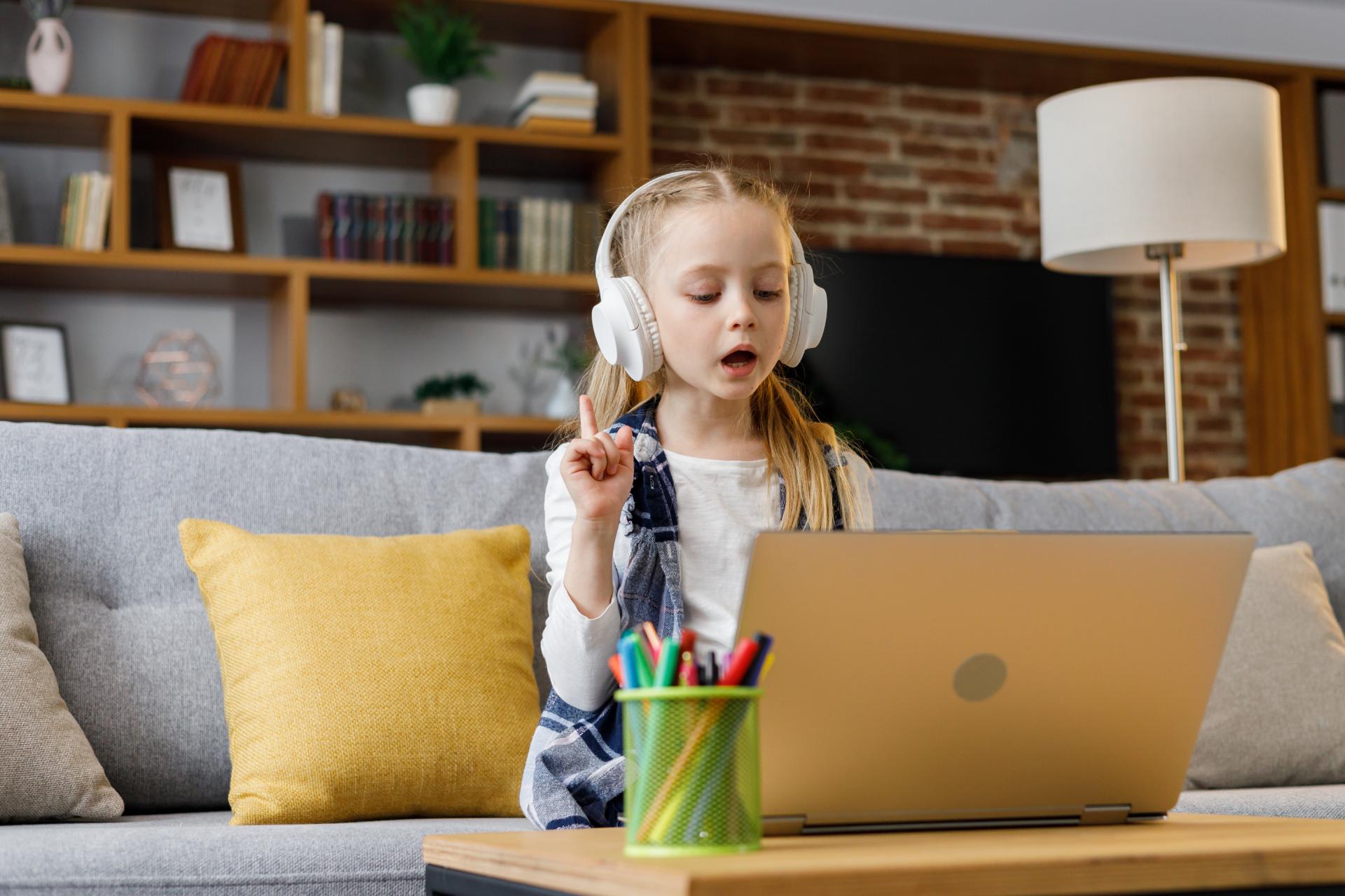 cute-primary-school-girl-studying-at-home-using-la-2026-01-07-00-39-29-utc (1)